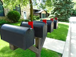 4 mailboxes with red flags